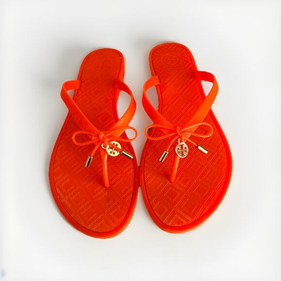 Tory Burch Shoes - Tory Burch Jelly Bow Tie Gold Logo Flip Flops flats , Poppy Orange, Size 9